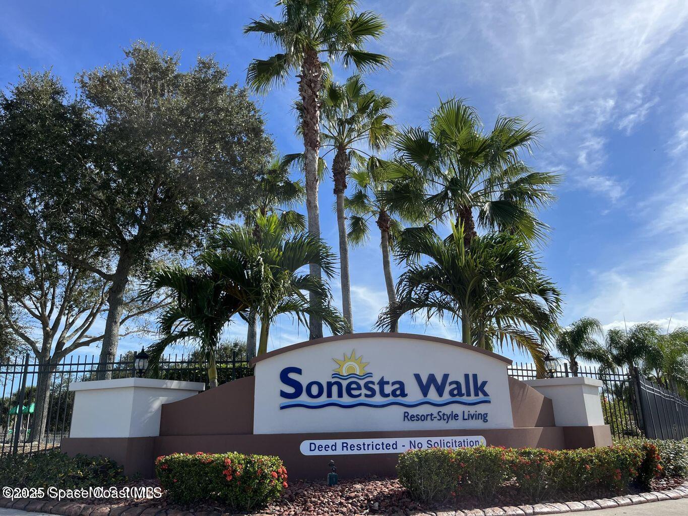 975 Luminary Circle, Unit 103 Melbourne, FL 32901 - Photo 62 of 70 a sign broad on the side of the road