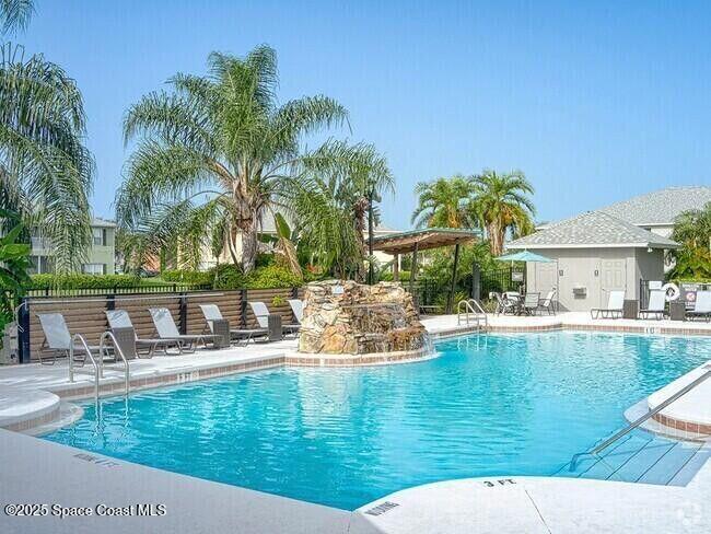 975 Luminary Circle, Unit 103 Melbourne, FL 32901 - Photo 63 of 70 a view of a swimming pool with a patio