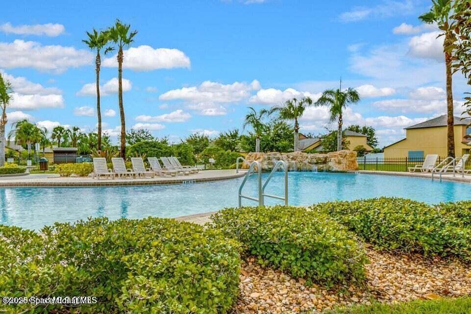 975 Luminary Circle, Unit 103 Melbourne, FL 32901 - Photo 64 of 70 a view of a lake with a beach