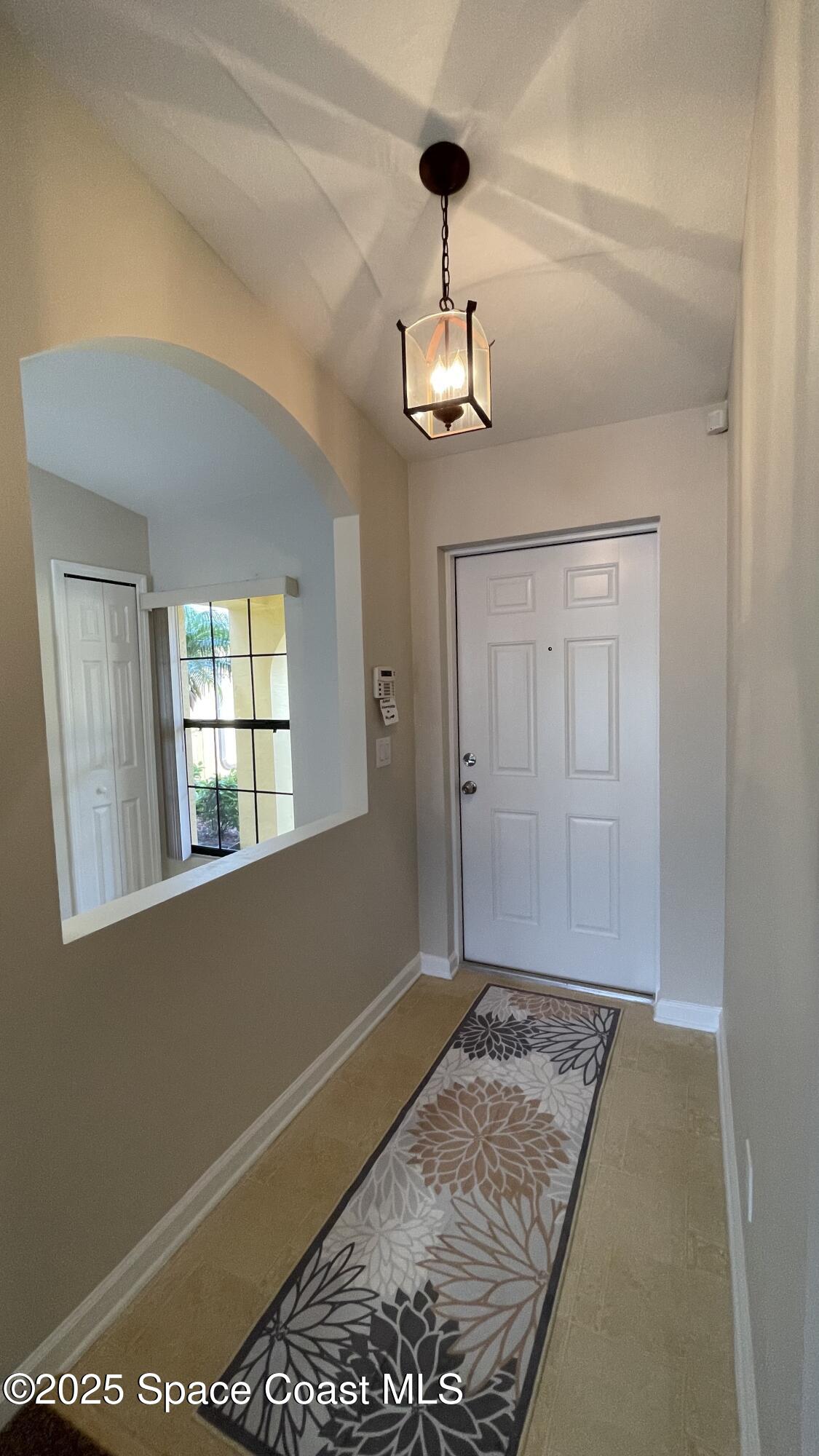 975 Luminary Circle, Unit 103 Melbourne, FL 32901 - Photo 6 of 70 a view of an empty room with a window