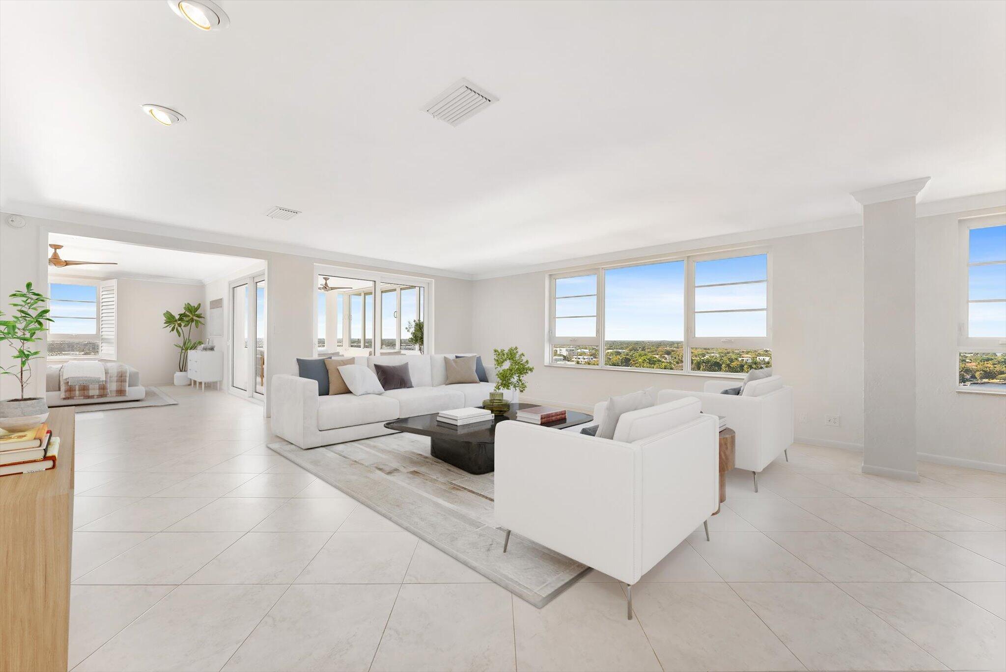 50 E Road, Unit 12A Delray Beach, FL 33483 - Photo 1 of 47 a living room with furniture and a large window