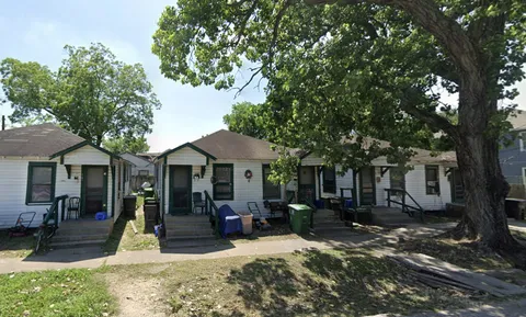 a view of a house with backyard porch and sitting area