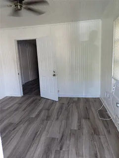 a view of a livingroom with wooden floor