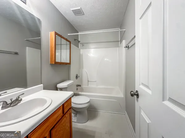 a front view of a house with yard