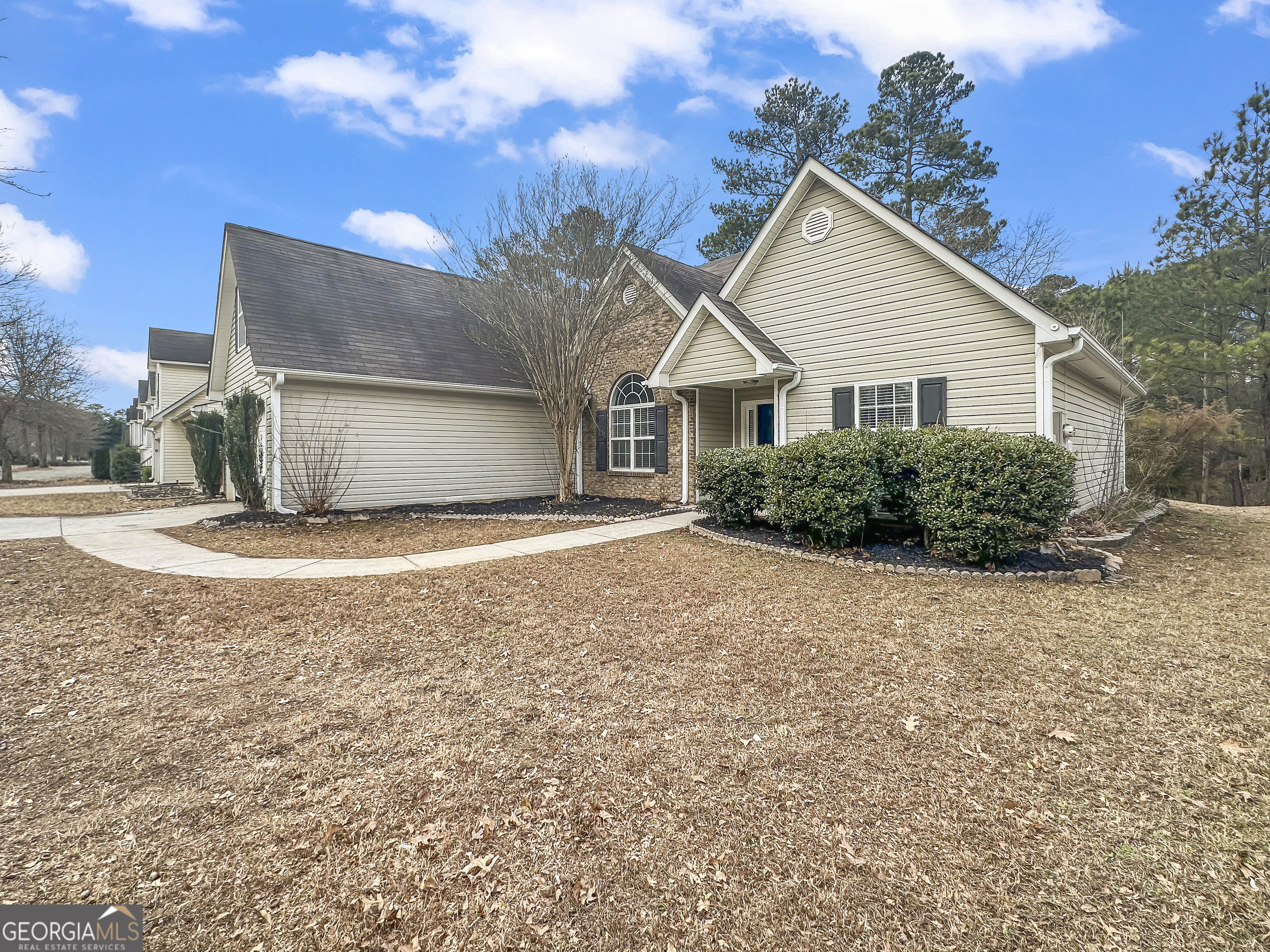 1395 Stephens Pond View Loganville, GA 30052 - Photo 3 of 20 a view of a house with a backyard