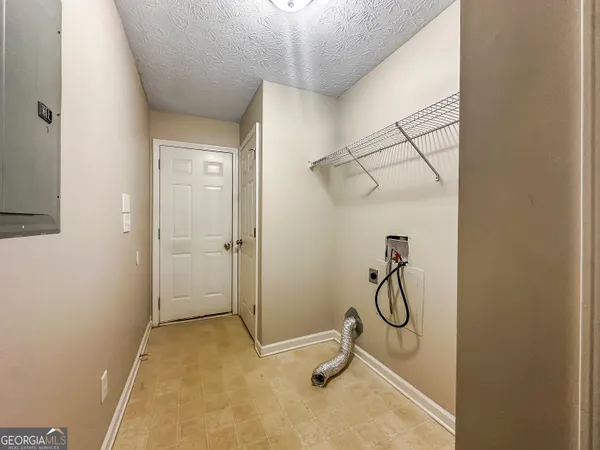 an empty room with a empty space and windows