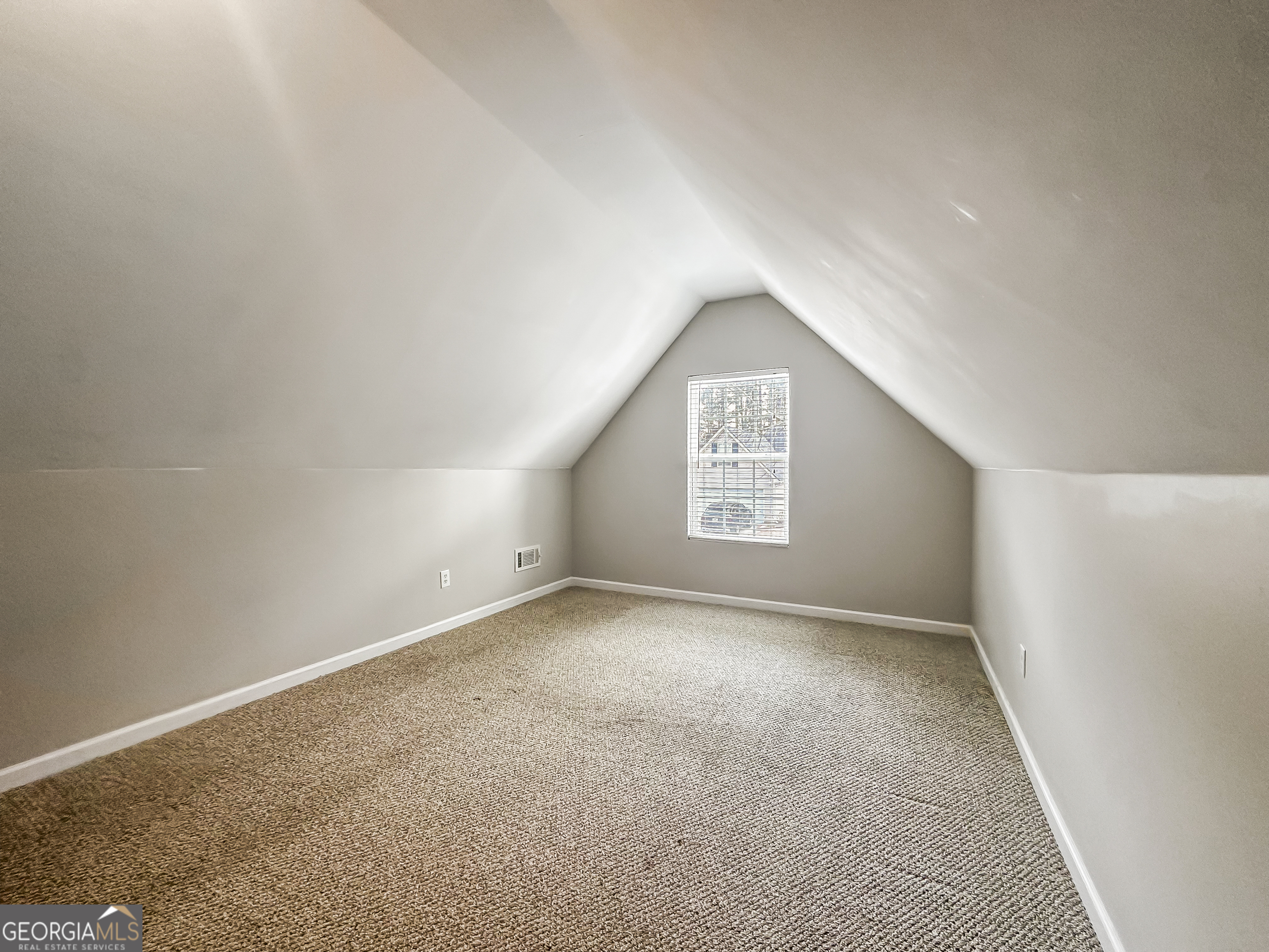 1395 Stephens Pond View Loganville, GA 30052 - Photo 9 of 20 an empty room with a empty space and windows
