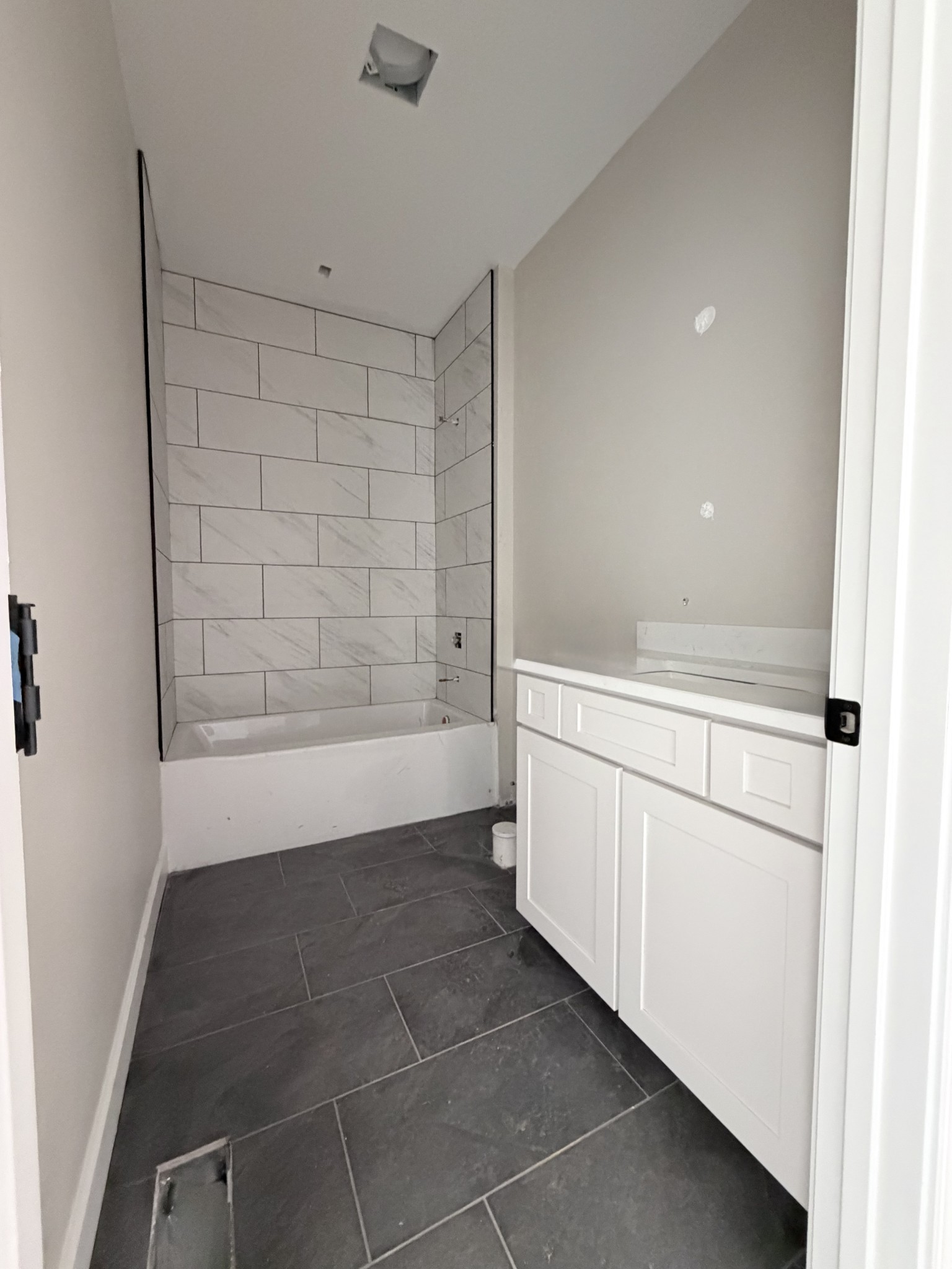 1238 Breeden Road Charlotte, TN 37036 - Photo 19 of 24 a bathroom with a bathtub and a shower