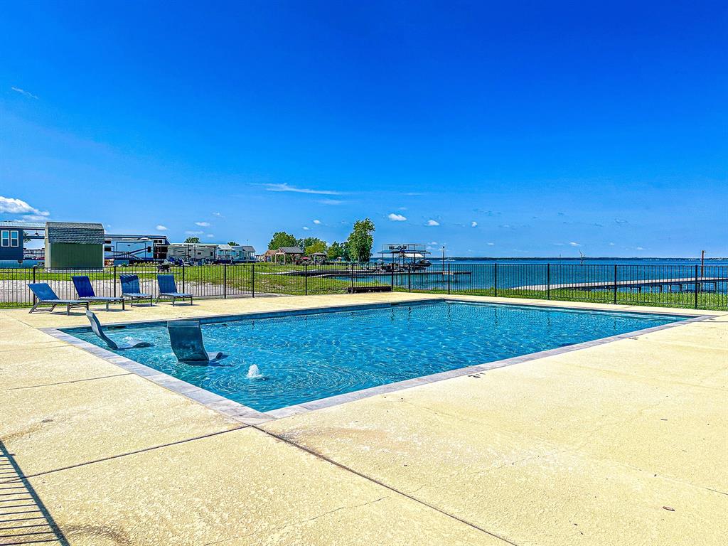 Lot 117 Peninsula Road Kerens, TX 75144 - Photo 29 of 34 a view of a swimming pool and an outdoor space
