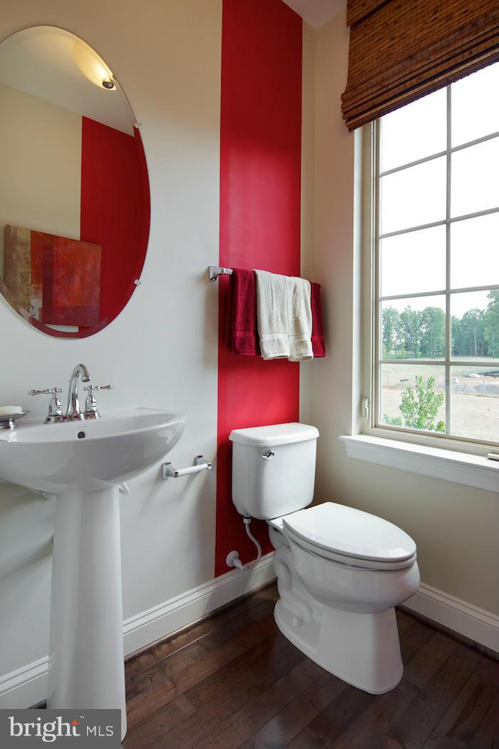 42262 Rhett Drive Ashburn, VA 20148 - Photo 11 of 30 a bathroom with a toilet sink and mirror