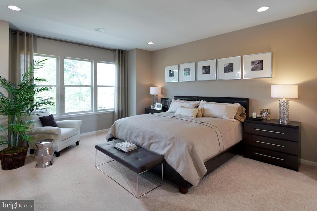 42262 Rhett Drive Ashburn, VA 20148 - Photo 12 of 30 a bedroom with a large bed and windows