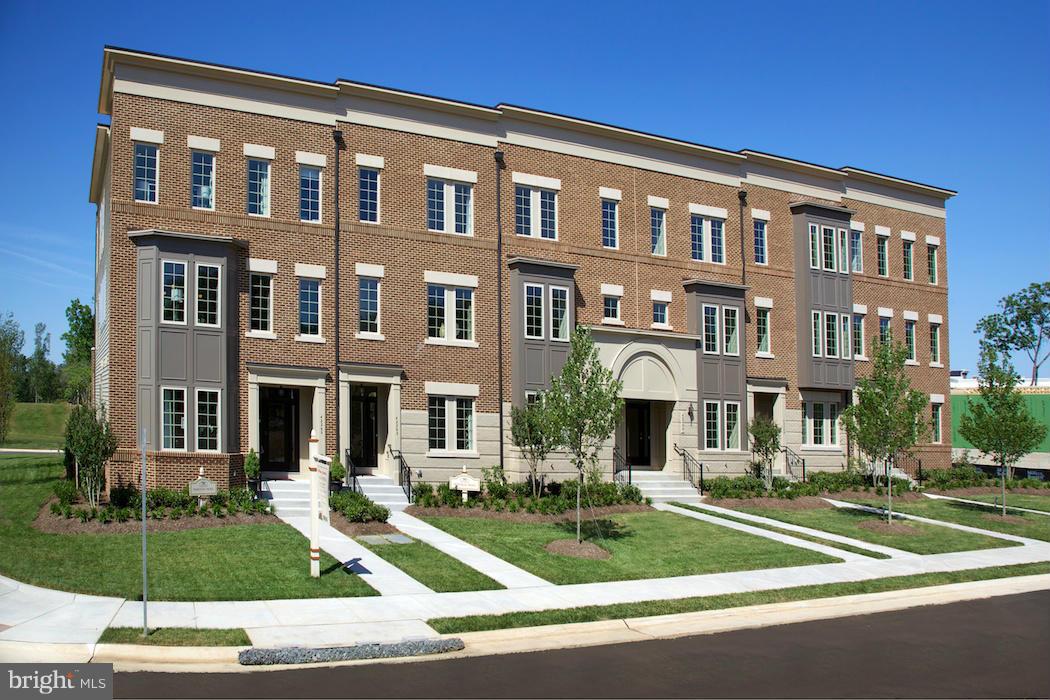 42262 Rhett Drive Ashburn, VA 20148 - Photo 3 of 30 a front view of a residential apartment building with a yard