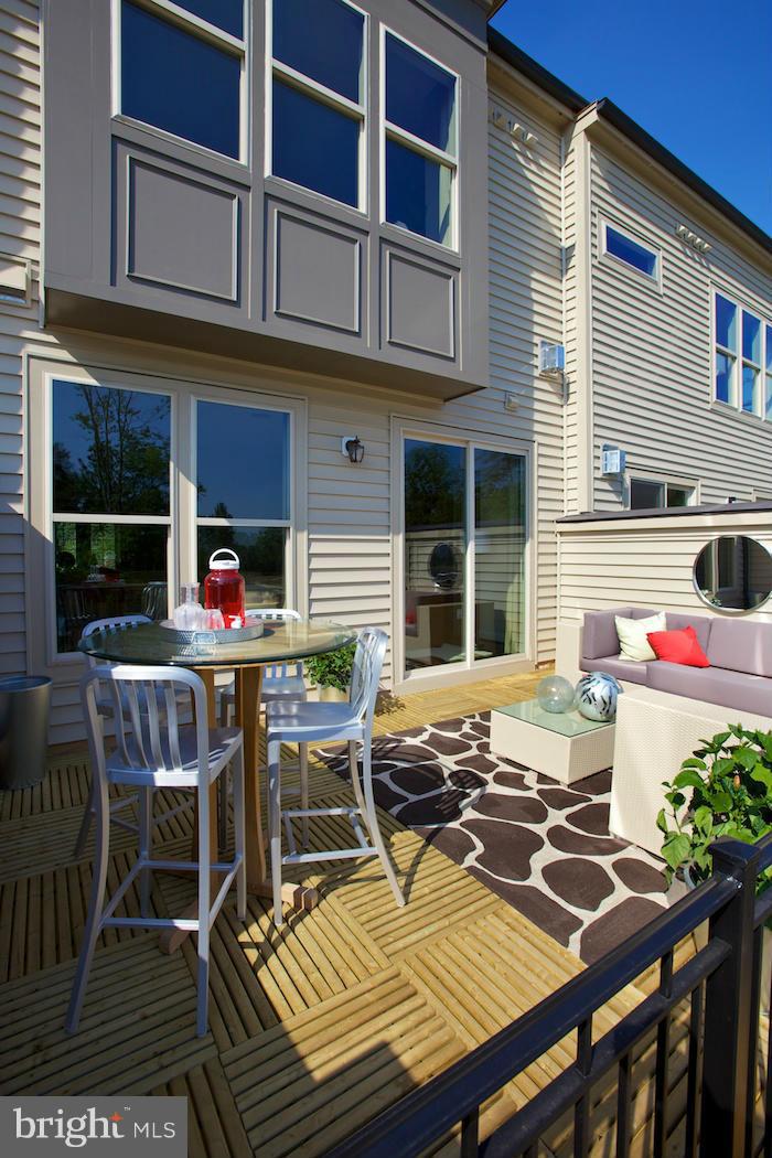 42262 Rhett Drive Ashburn, VA 20148 - Photo 24 of 30 a view of a dinning table and chairs in the balcony