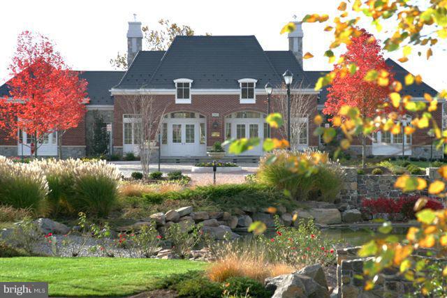 42262 Rhett Drive Ashburn, VA 20148 - Photo 27 of 30 a view of a house with a yard and a large tree