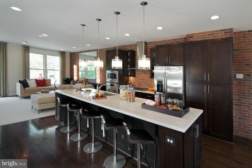 42262 Rhett Drive Ashburn, VA 20148 - Photo 6 of 30 a large kitchen with a table and chairs