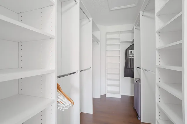 a view of house with a backyard and a garden