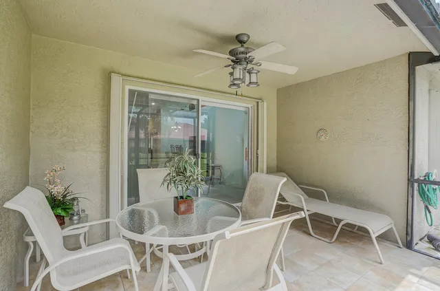 an aerial view of residential houses with outdoor space and lake view