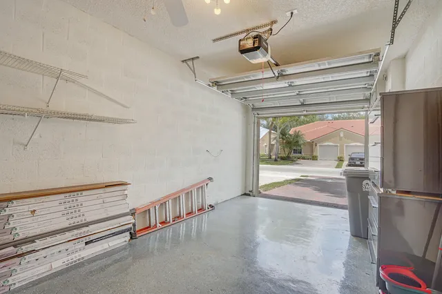 a living room with fireplace furniture and a chandelier