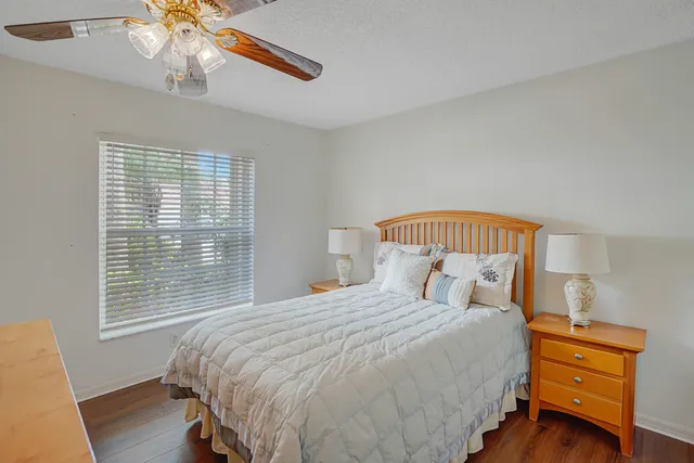a view of a dining room with furniture and a chandelier