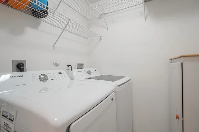 a kitchen with granite countertop a sink a stove and cabinets
