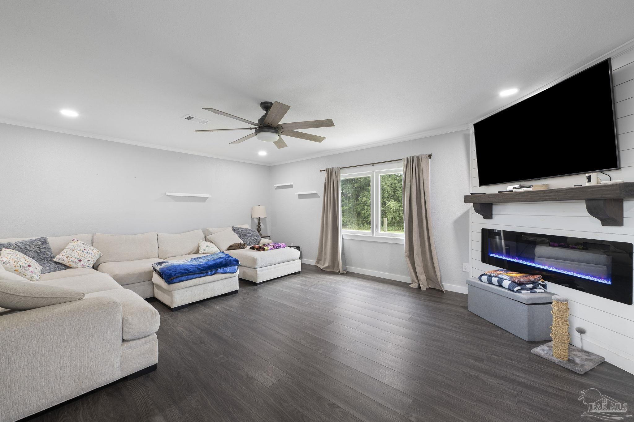 2065 Brownsdale Loop Road Jay, FL 32565 - Photo 12 of 25 a living room with furniture and a flat screen tv