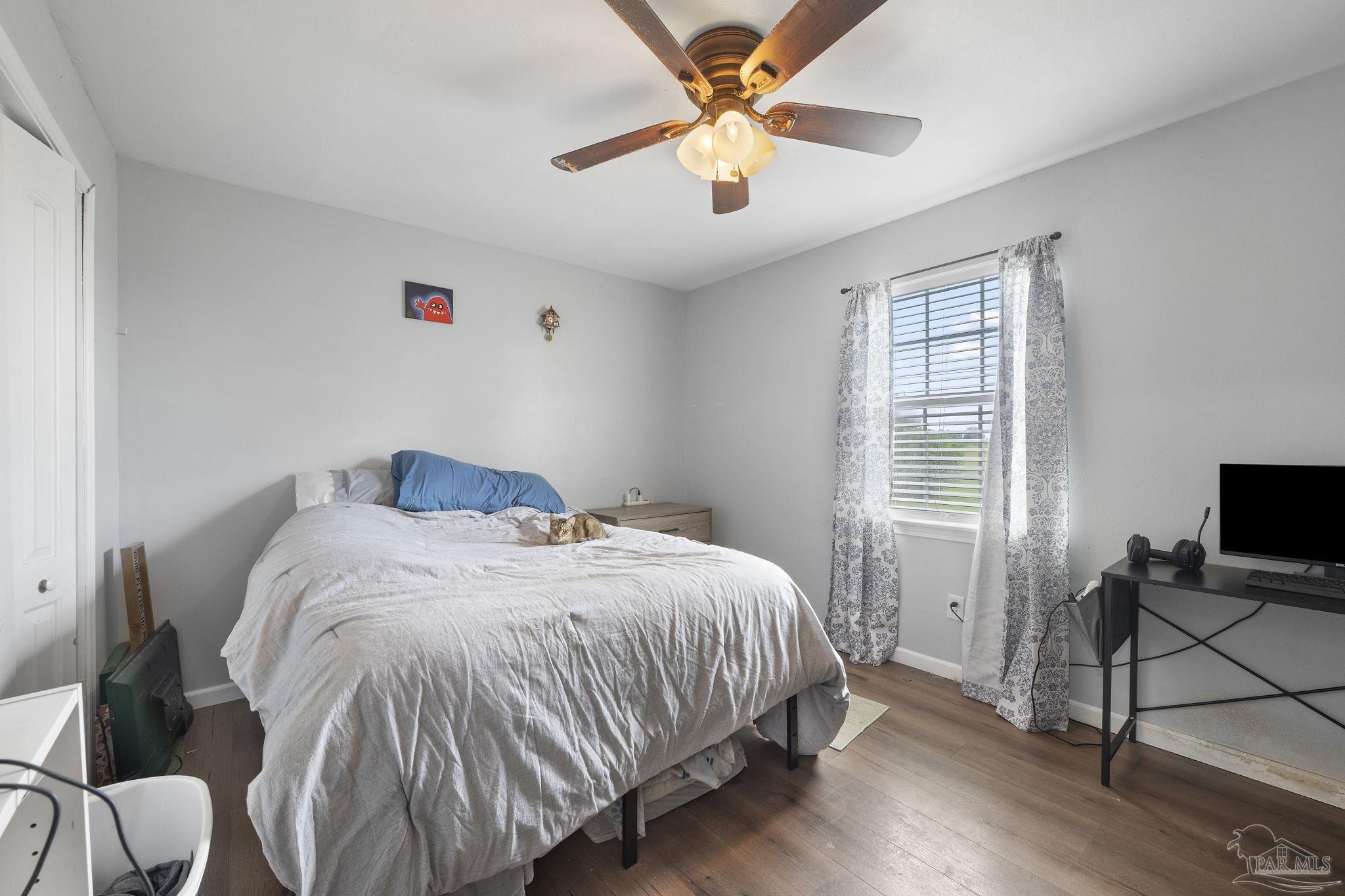 2065 Brownsdale Loop Road Jay, FL 32565 - Photo 19 of 25 a bedroom with a bed and a window