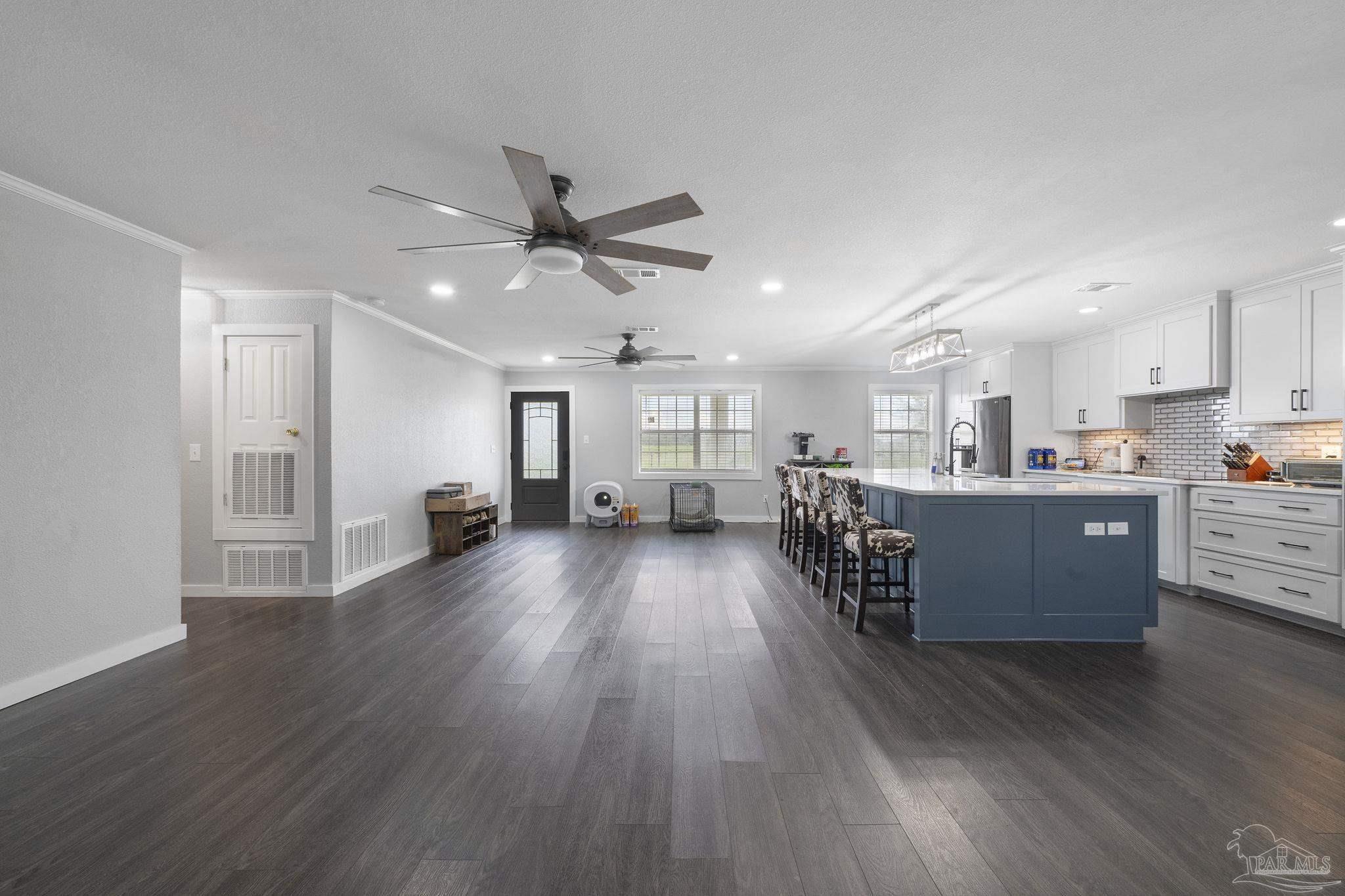 2065 Brownsdale Loop Road Jay, FL 32565 - Photo 5 of 25 a view of a kitchen with wooden floor and a window
