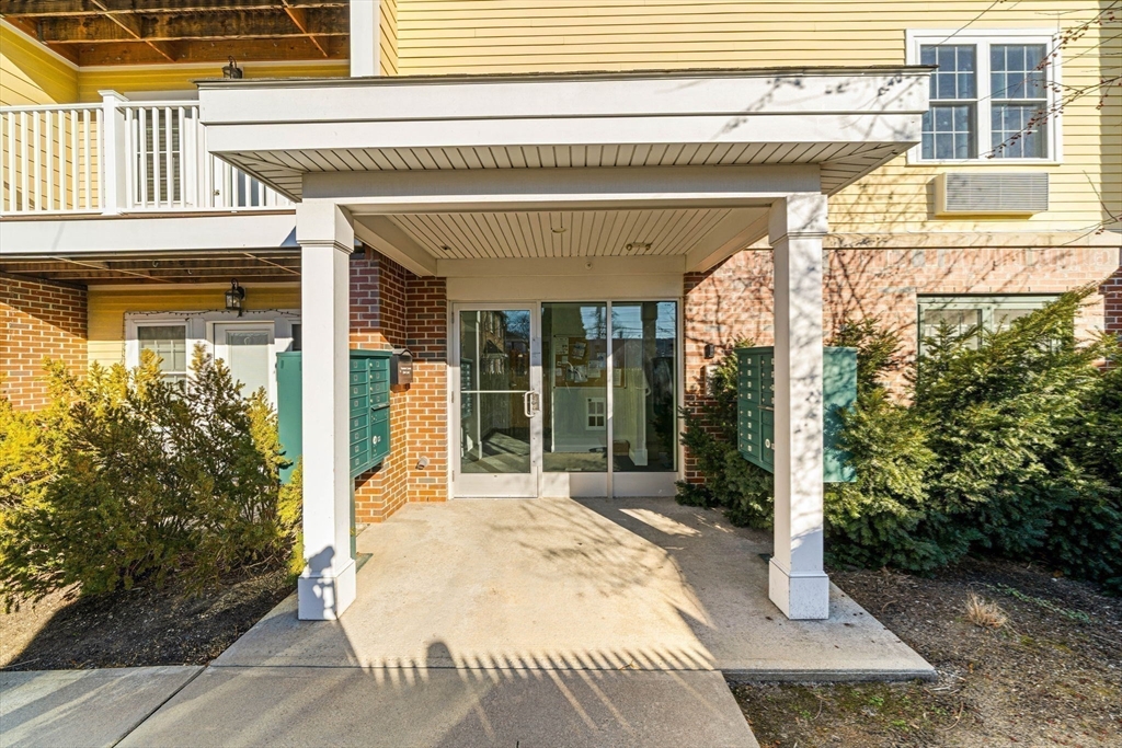 39 Fayette Street, Unit 403 Quincy, MA 02171 - Photo 21 of 24 a view of a patio with table and chairs and potted plants