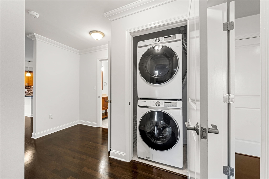 39 Fayette Street, Unit 403 Quincy, MA 02171 - Photo 9 of 24 a view of a hallway with washer and dryer