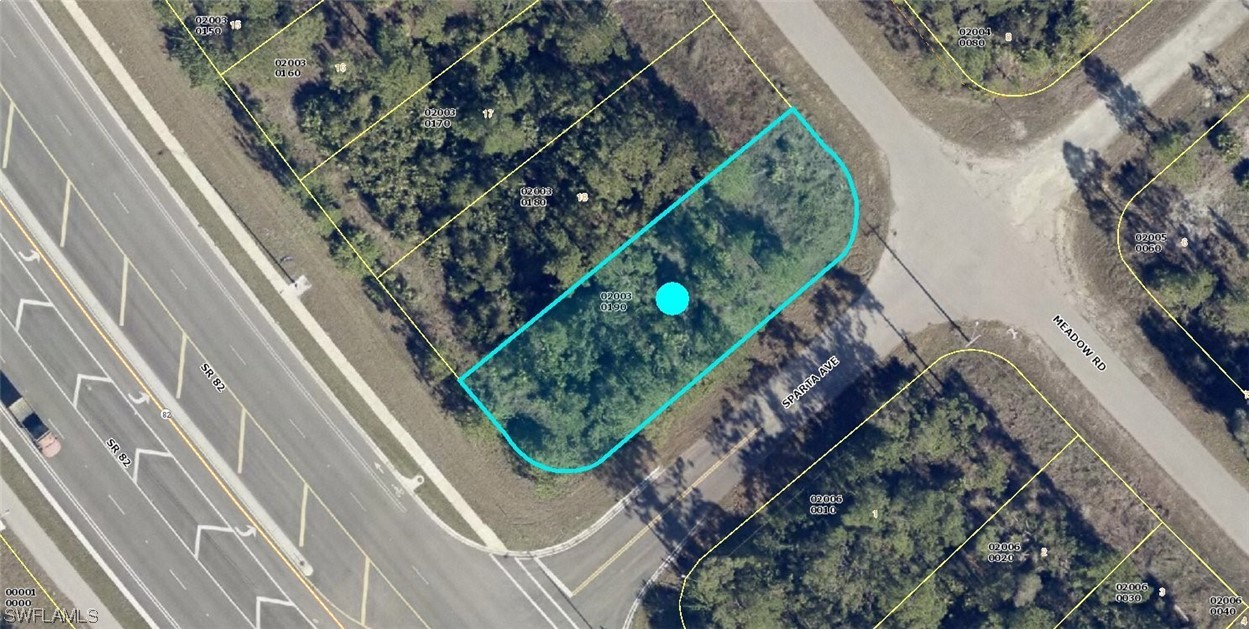 2436 Meadow Road Lehigh Acres, FL 33974 - Photo 3 of 6 a bird view of a garden