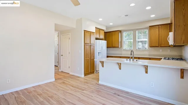 a view of bedroom with wooden floor and front door