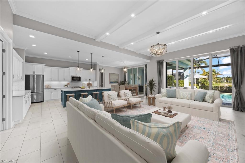 a living room with furniture kitchen view and a large window