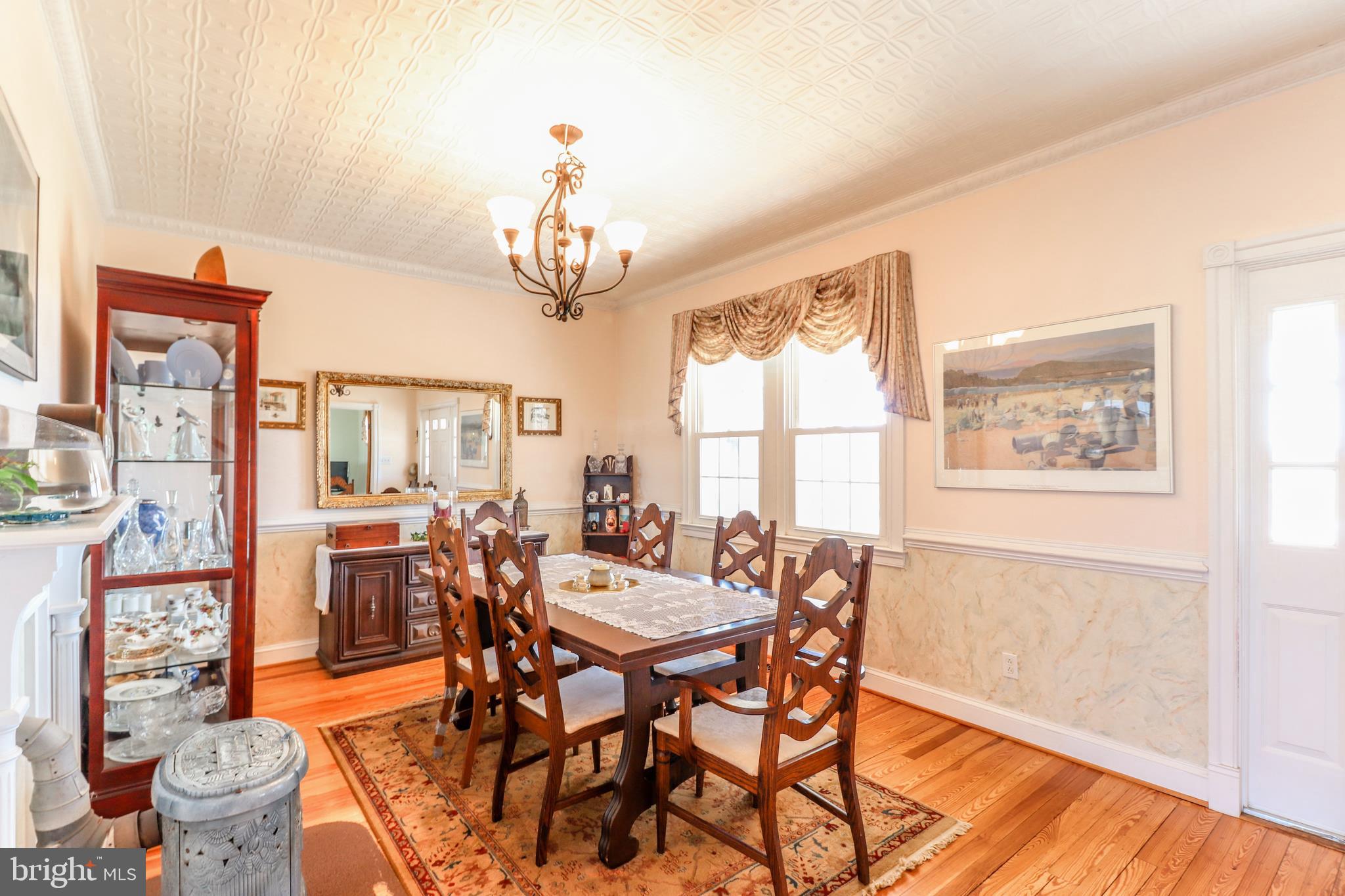 44750 Springer Road Valley Lee, MD 20692 - Photo 14 of 42 formal dining room w/ French porcelain wood stove