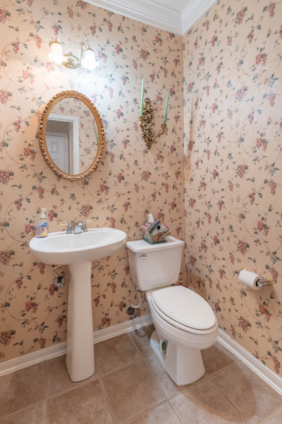 1205 Cambridge Court Seabrook, TX 77586 - Photo 11 of 47 a white toilet sitting next to a bathroom sink