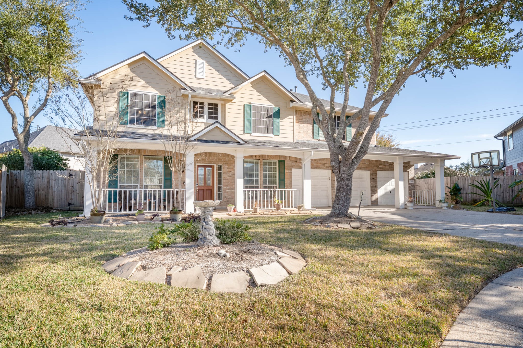 1205 Cambridge Court Seabrook, TX 77586 - Photo 2 of 47 a front view of a house with a yard