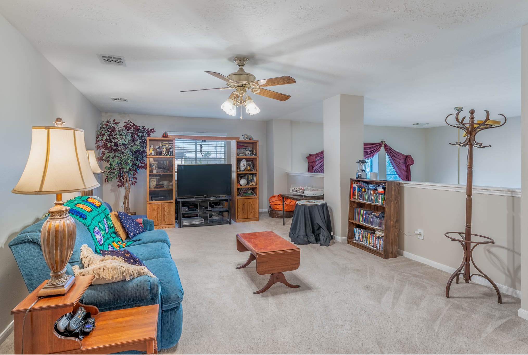 1205 Cambridge Court Seabrook, TX 77586 - Photo 38 of 47 a living room with furniture and a flat screen tv