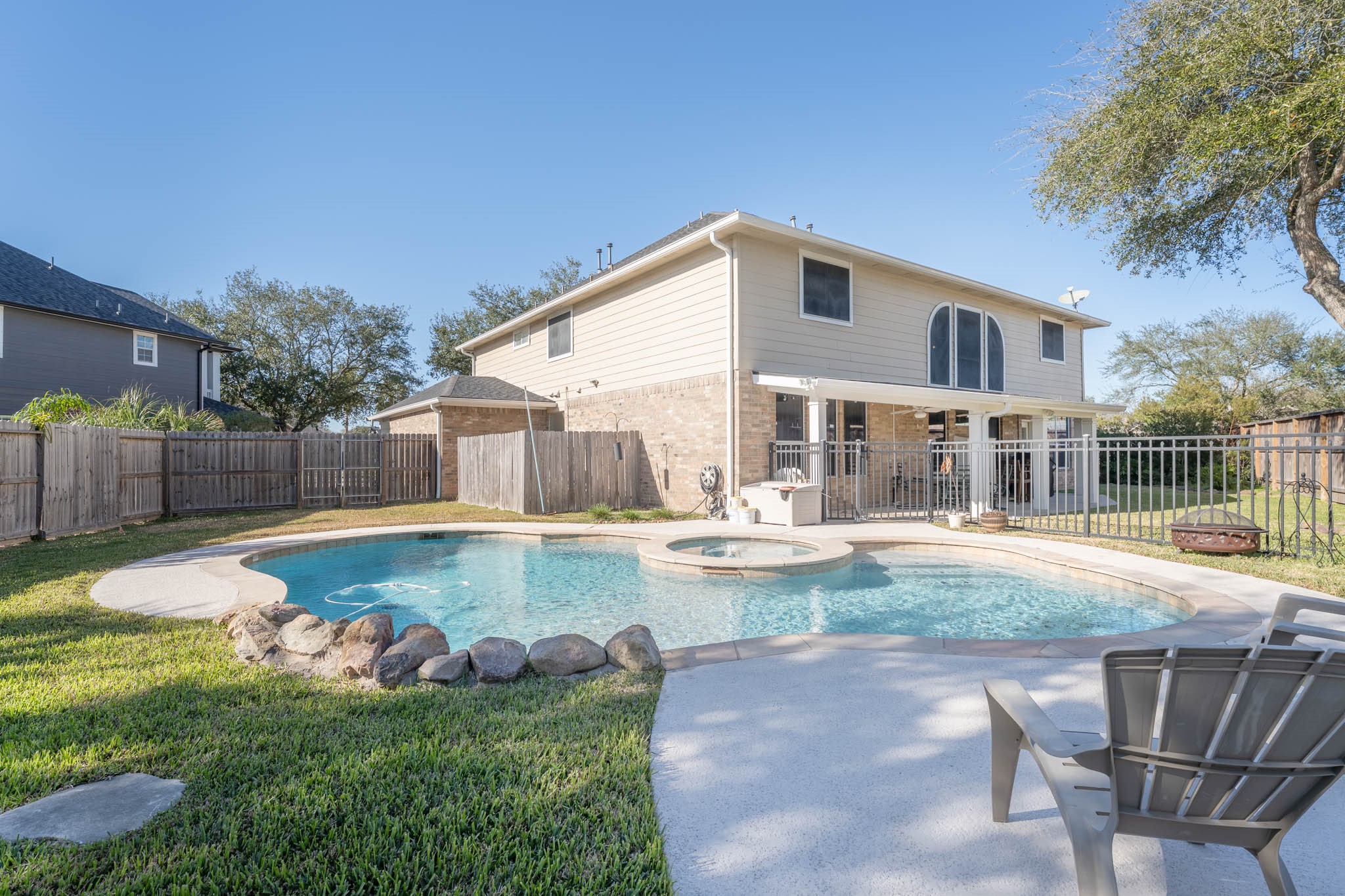 1205 Cambridge Court Seabrook, TX 77586 - Photo 46 of 47 a view of a backyard with swimming pool