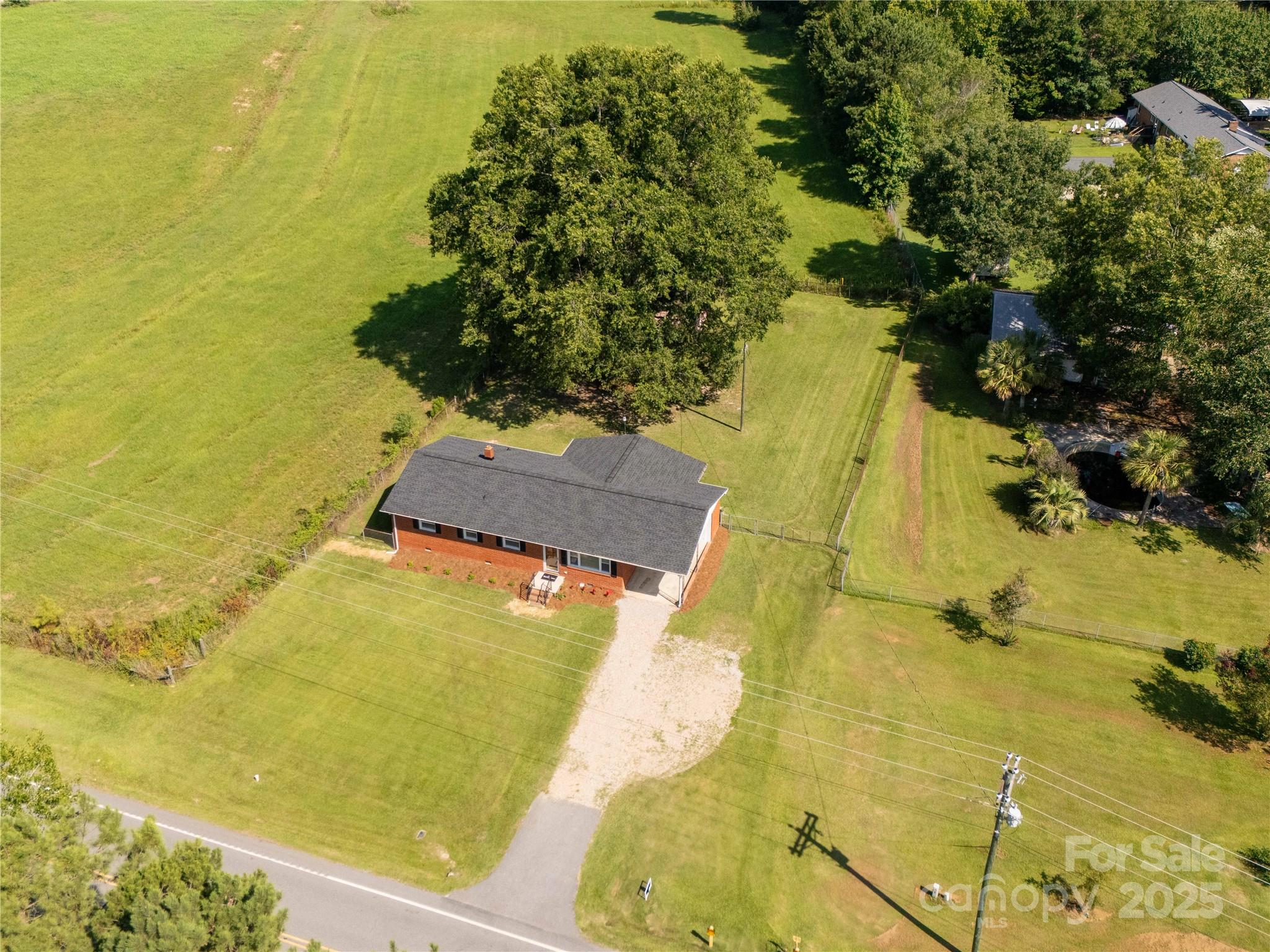 an aerial view of residential houses with swimming pool