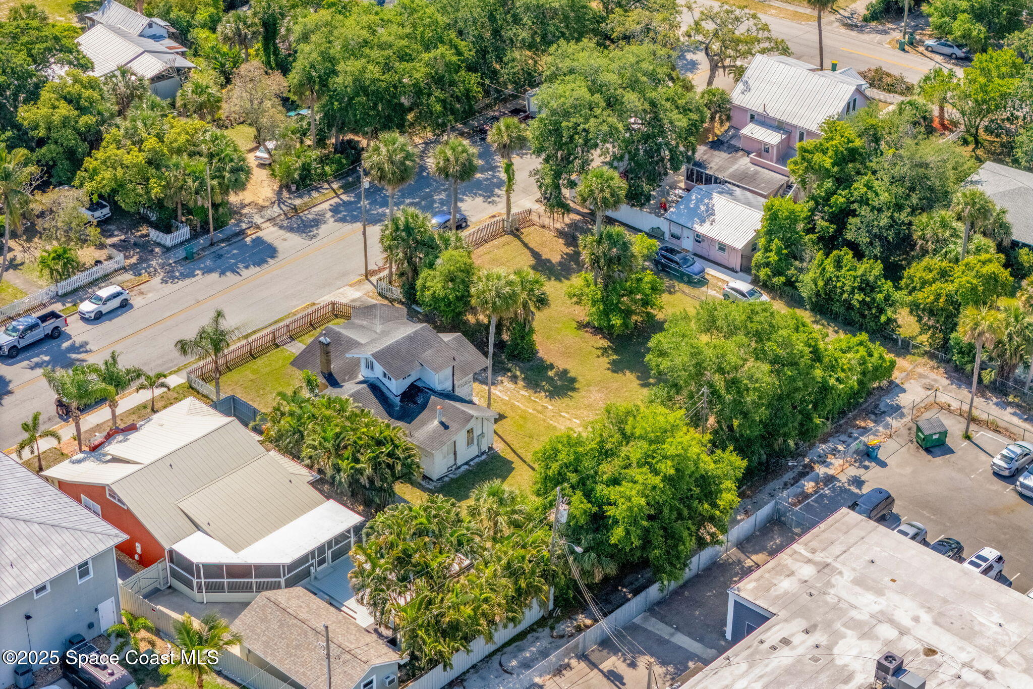 2106 Vernon Place Melbourne, FL 32901 - Photo 20 of 33 an aerial view of a house with a yard and lake view