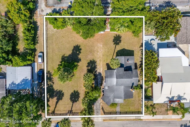 an aerial view of houses and roads