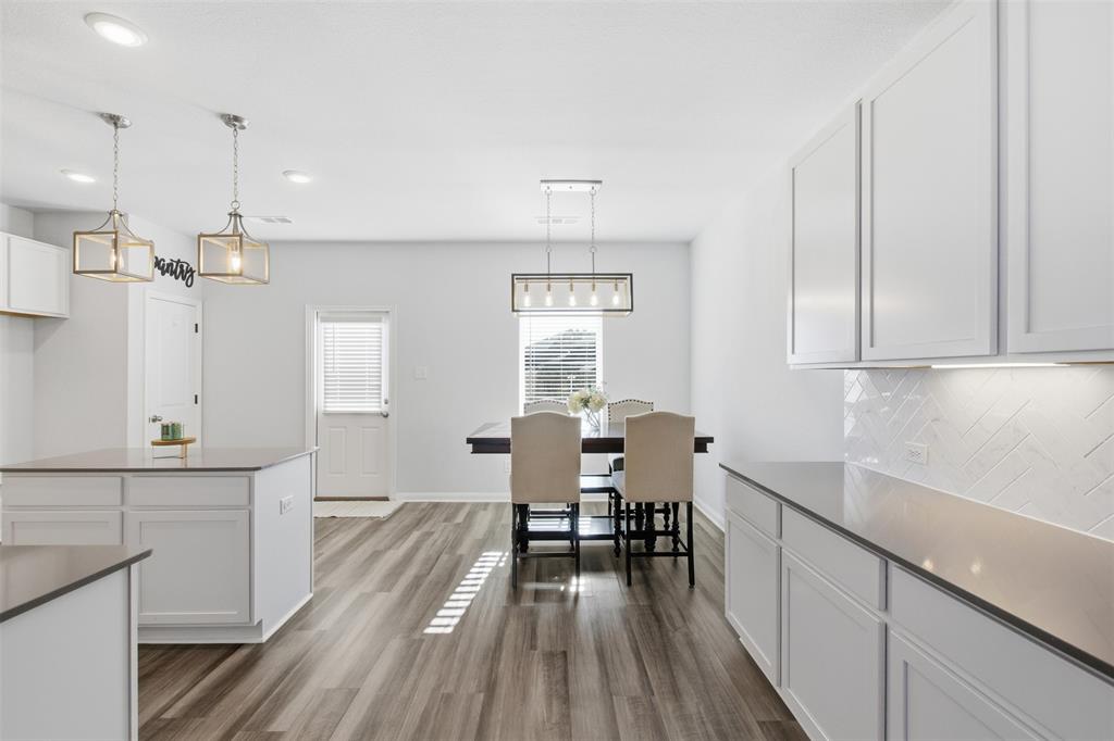 2049 Hartley Drive Forney, TX 75126 - Photo 15 of 36 a kitchen with white cabinets and sink