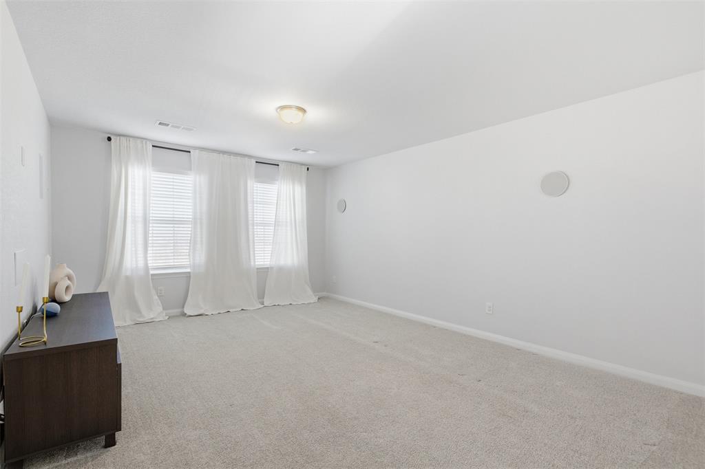 2049 Hartley Drive Forney, TX 75126 - Photo 25 of 36 a view of an empty room with a window