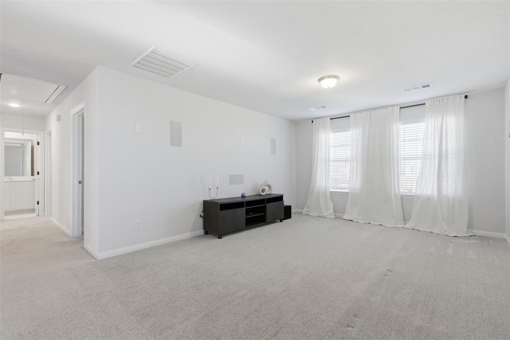 2049 Hartley Drive Forney, TX 75126 - Photo 27 of 36 an empty room with windows