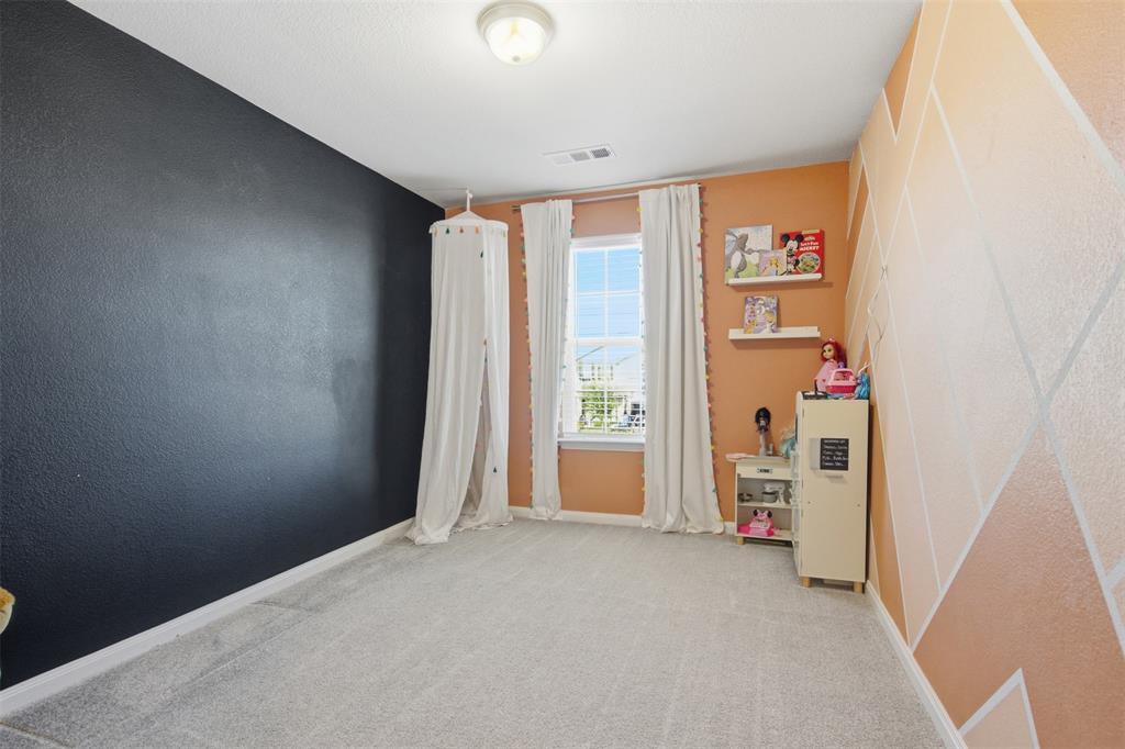 2049 Hartley Drive Forney, TX 75126 - Photo 29 of 36 an empty room with windows