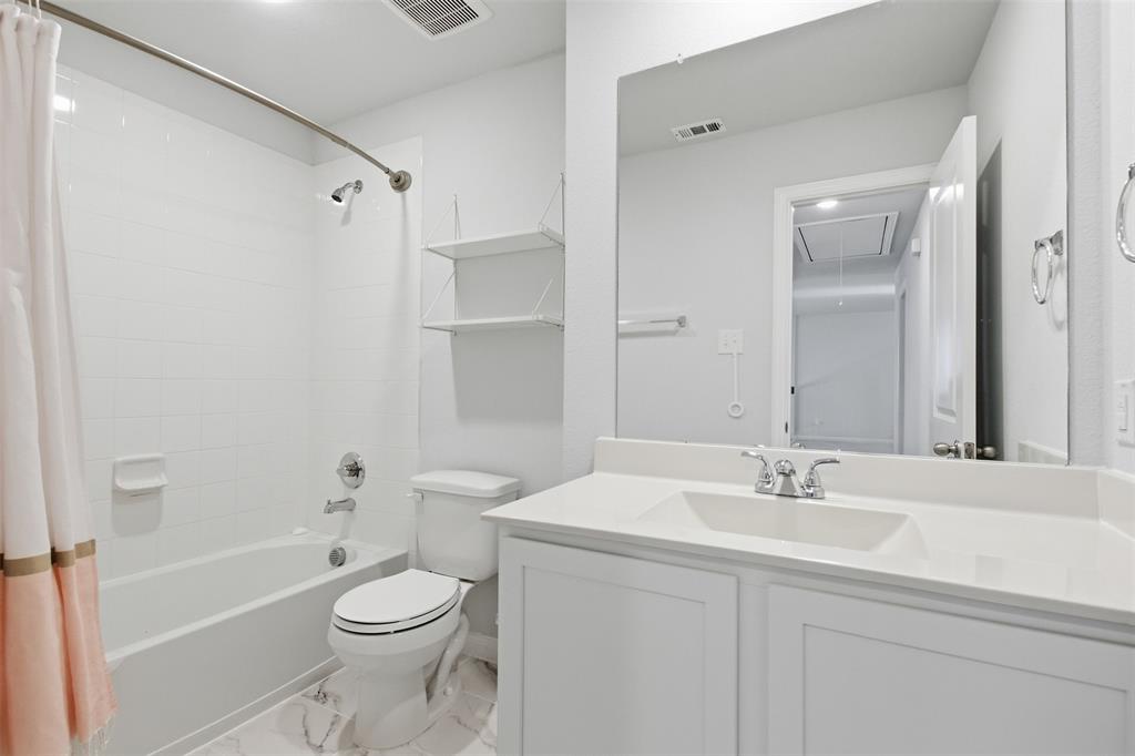 2049 Hartley Drive Forney, TX 75126 - Photo 31 of 36 a bathroom with a sink toilet and shower