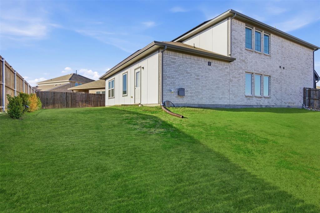 2049 Hartley Drive Forney, TX 75126 - Photo 32 of 36 a front view of a house with a yard