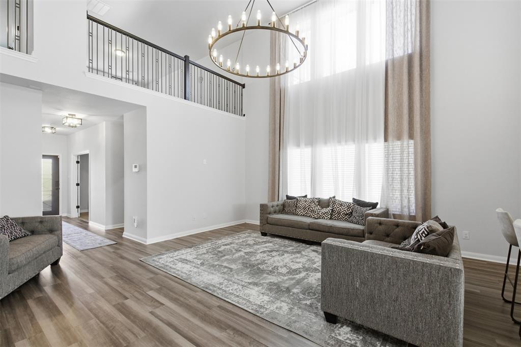 2049 Hartley Drive Forney, TX 75126 - Photo 9 of 36 a living room with furniture and a large window