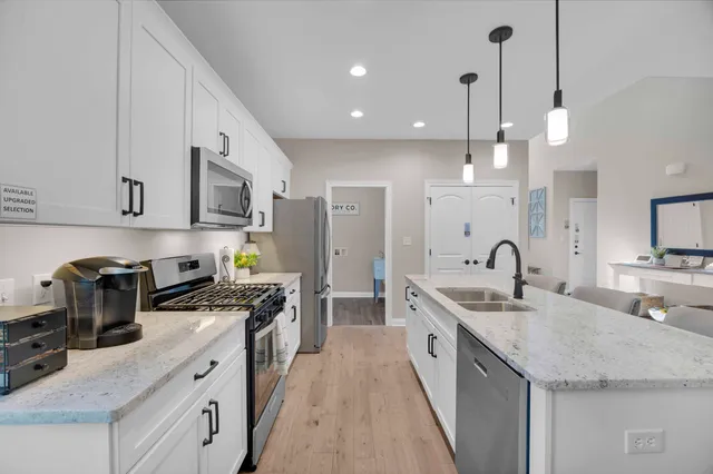 a kitchen with counter space cabinets and appliances