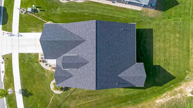 an aerial view of multiple houses with yard