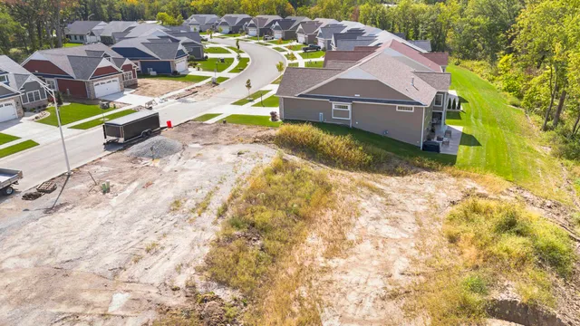 a aerial view of a house with a yard and garage